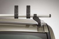 Close up picture of a Rhino Kammbar Pro Roof Bar with two ladder stops and foot pack attached the the roof bar fixing point on a van